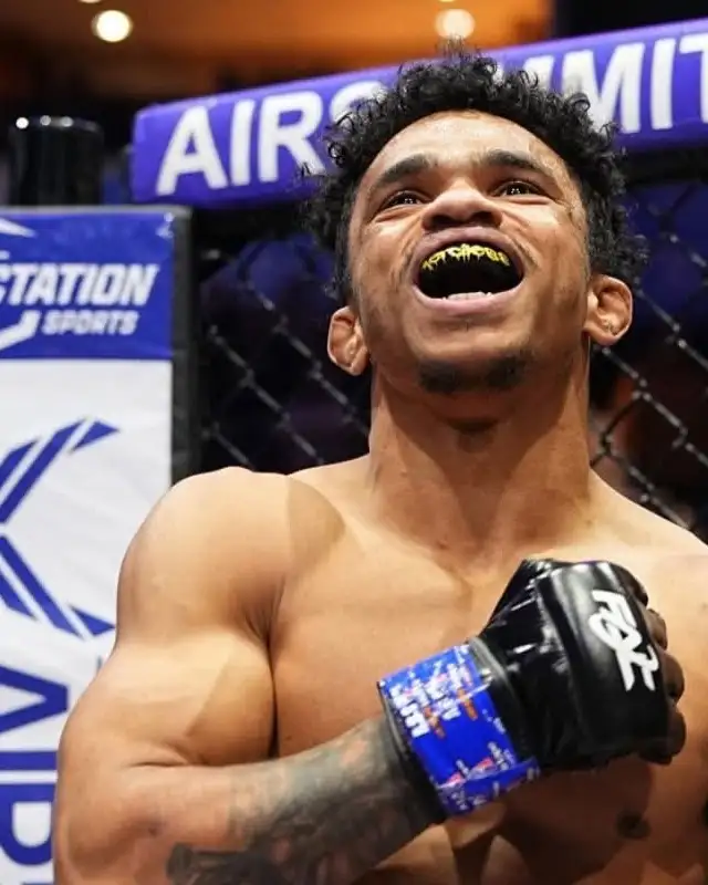 Mo Zwolak, MMA coach at Glory MMA & Fitness, celebrating in the cage