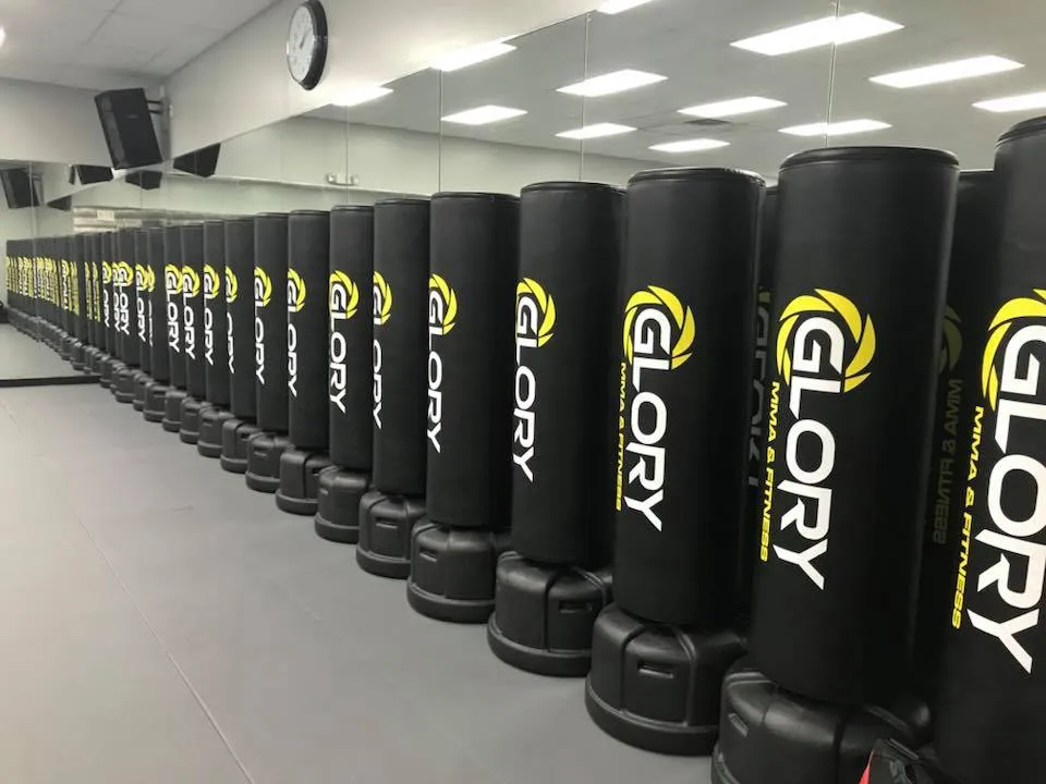 GloryFit kickboxing class working the heavy bags