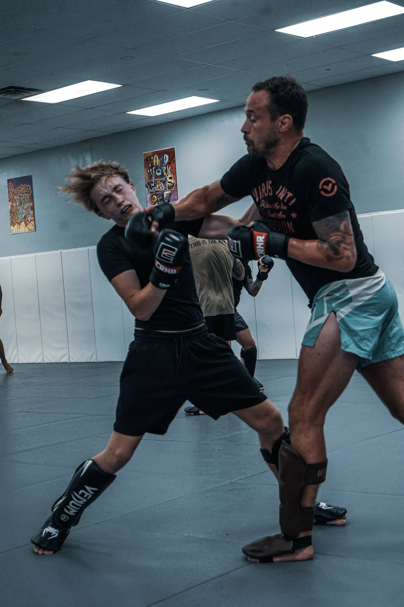 James Krause throwing a punch as a student slips