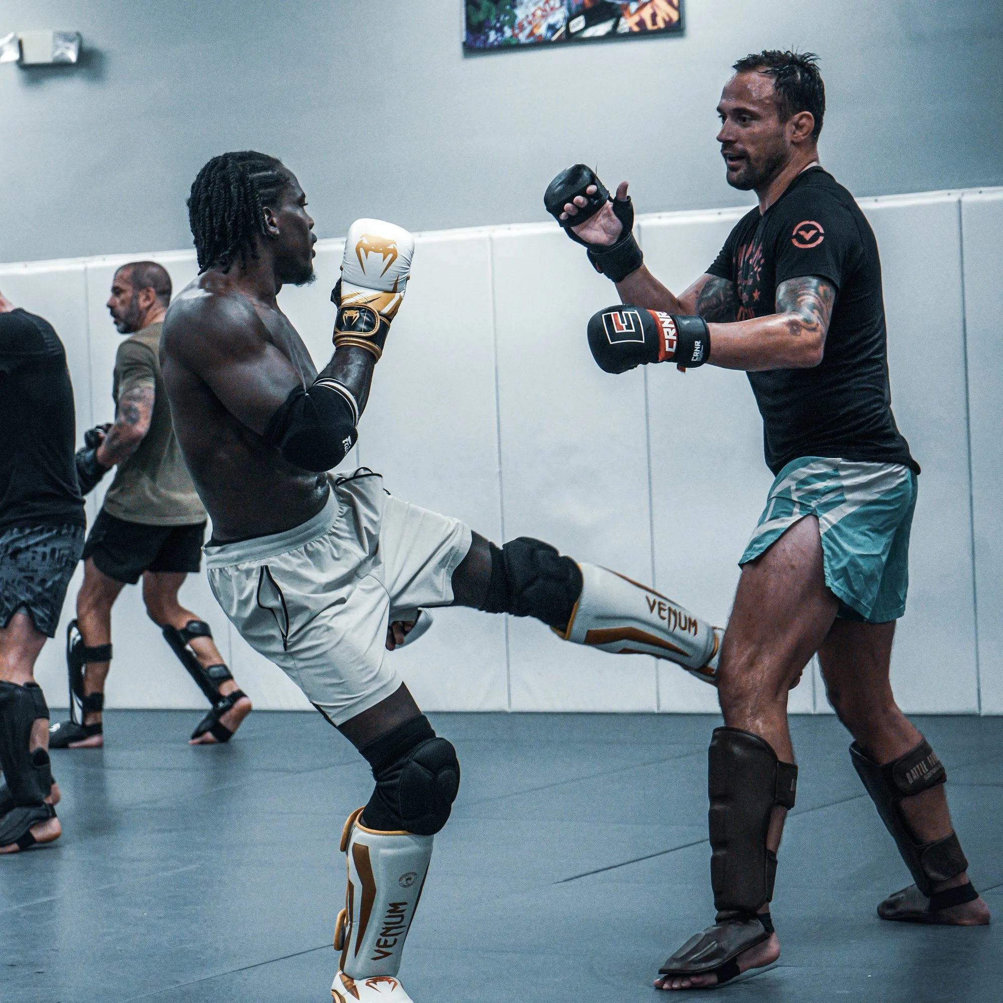 James Krause squares up as a training partner throws a kick during MMA sparring at Glory