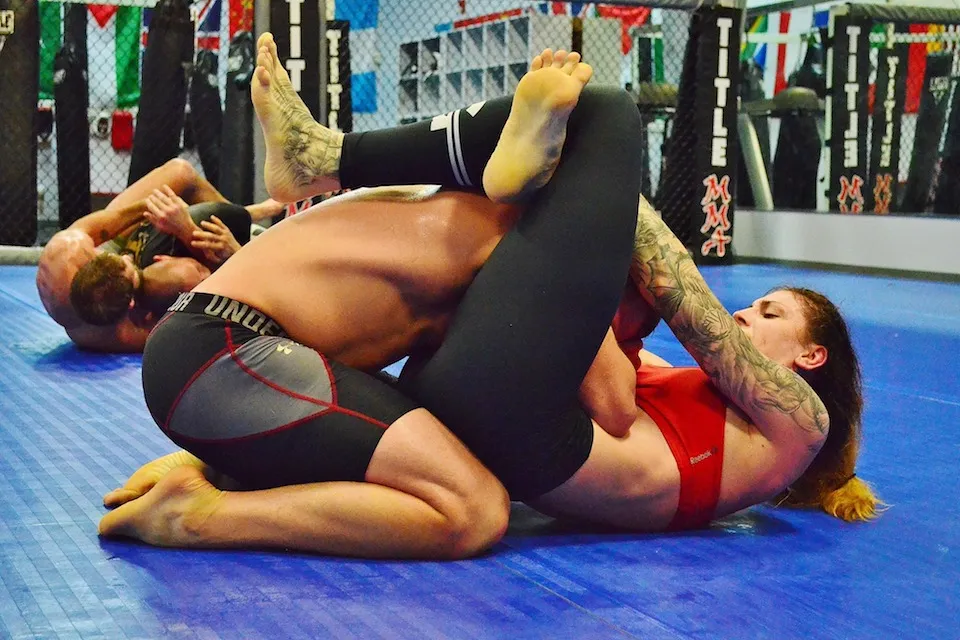 Adult man and woman no-gi grappling at Glory MMA & Fitness